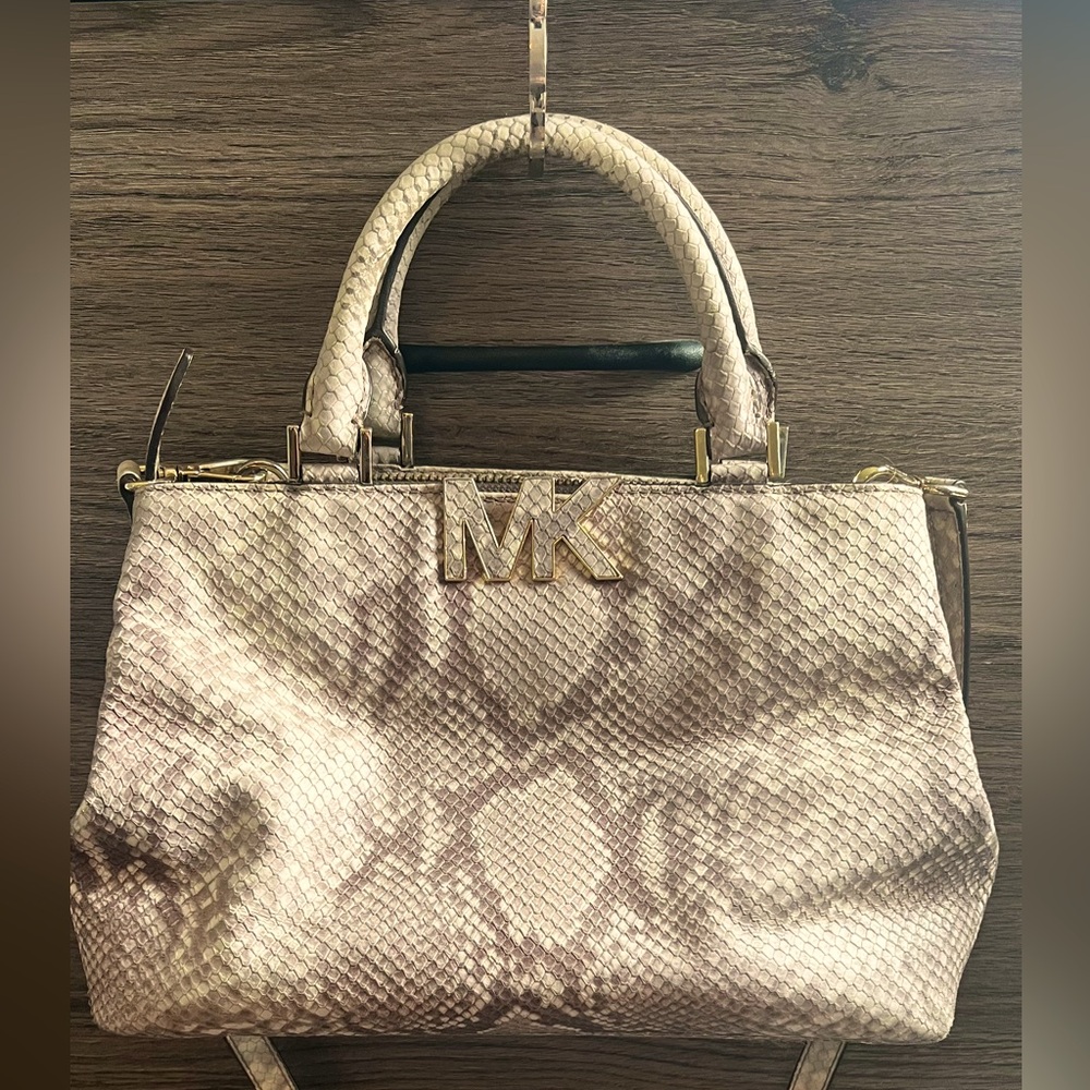 Michael Kors purse. Snakeskin pattern. Shoulder strap included.